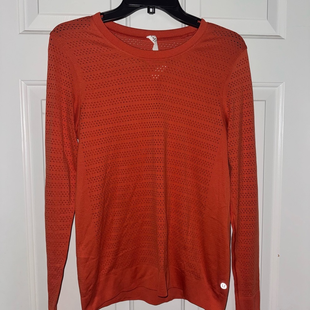 Lululemon orange long sleeve top with holes design